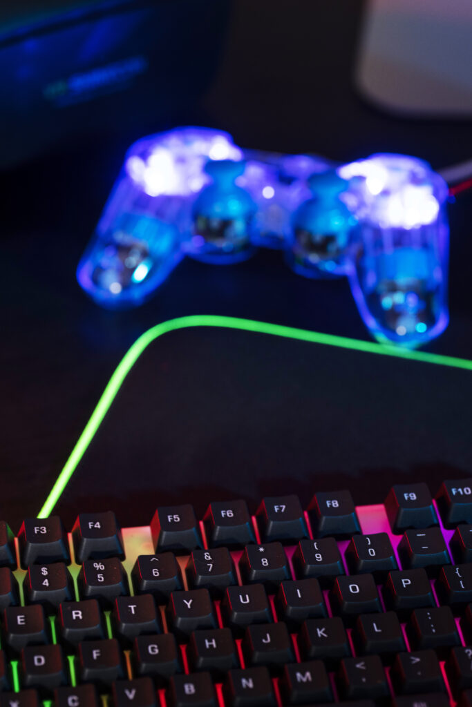 gradient-view-illuminated-neon-gaming-desk-setup-with-keyboard (1)